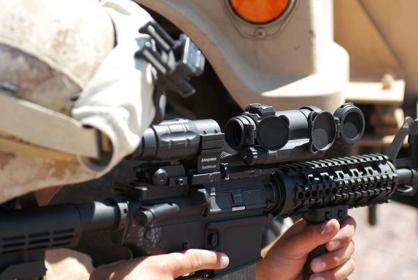 Aimpoint CompM4s and magnifier on M4 carbine